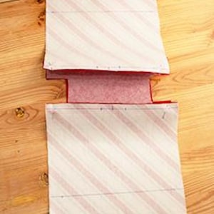 The process of sewing the bottom of the bag