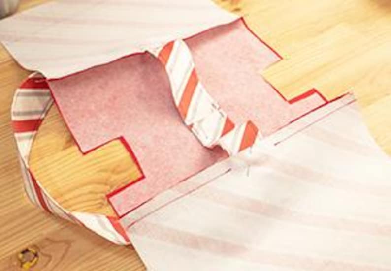 Bag handle assemblies