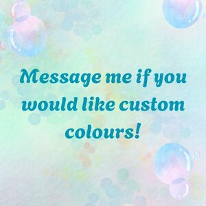 May include: A pastel-colored background with blue bubbles and the text "Message me if you would like custom colours!" in teal. The image has a soft, dreamy aesthetic.