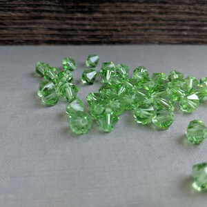 Swarovski (6mm) Peridot Bicone beads light green 25 Pieces jewelry making, couture embellishments Craft or Jewelry by JewelsCharmsMore