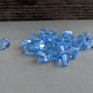 Swarovski (8mm) Light Sapphire Bicone beads 25 Pieces jewelry making, couture embellishments Craft or Jewelry by JewelsCharmsMore