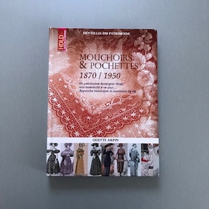 May include: A book titled "MOUCHOIRS & POCHETTES 1870/1950" with a detailed lace design on the cover. The book features images of vintage clothing and the author's name, Odette Arpin. The cover has text in French.