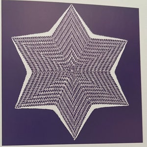 May include: A white, crocheted star doily with a six-pointed design. The intricate openwork pattern is set against a dark blue background. The doily's edges are clearly defined, showcasing the detailed craftsmanship.