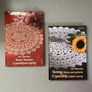 May include: Two books with red and black covers featuring white lace doilies and the text "Tatted Treasures Frywolttkowe skarby" and "Tatting theory and patterns Frywolitka szkoła i wzory".