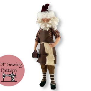 May include: A PDF sewing pattern for a Santa Claus doll wearing a brown apron, plaid shirt, and white beard. The doll is holding a toolbox and a piece of paper.