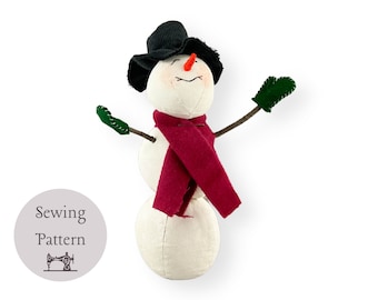 May include: A white snowman with a black hat, red scarf, and green mittens. The snowman has a carrot nose and a stitched smile. The image includes the text "Sewing Pattern" with a sewing machine icon.