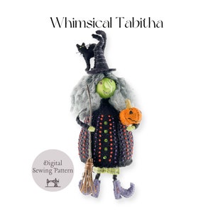 May include: A digital sewing pattern for a whimsical witch doll called Tabitha. The doll is wearing a black and green outfit with a black hat and a black cat on top. She is holding a small orange pumpkin and a broom.