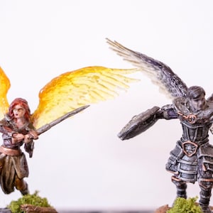 Female Aasimar and Fallen Assimar painted mini