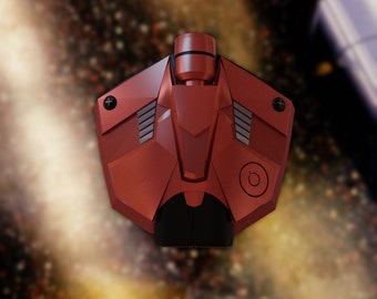 May include: A red and black drone with a power button and a textured surface. The drone has a futuristic design and is hovering in the air.
