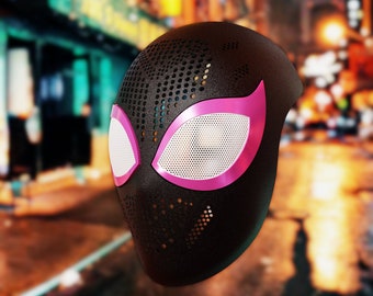 May include: Black and pink spider-man mask with a mesh design. The mask has a black background with a pink spider-eye design.