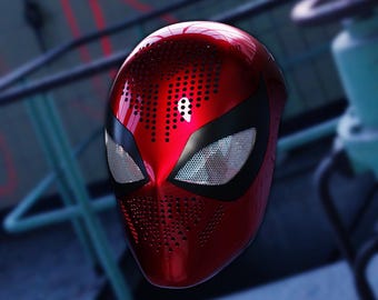May include: A glossy red Spider-Man mask with black eye surrounds and mesh eye coverings. The mask has a perforated pattern across the forehead and mouth area. The mask is a superhero costume accessory.