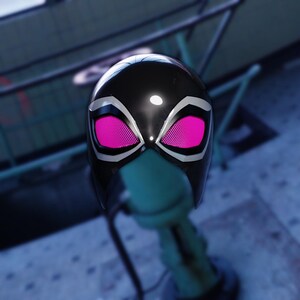 May include: A black helmet with a glossy finish, featuring white accents around the eye openings. The eye openings are filled with a bright pink mesh material. The helmet is designed with a sleek, modern aesthetic.