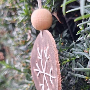 Snowflake on Leather Handcrafted handstitched leather ornament