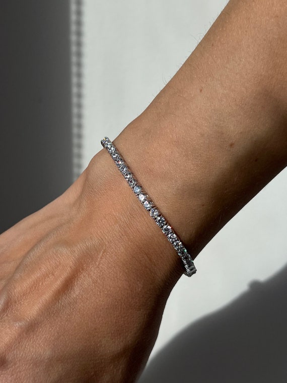 Gold-plated Sterling Circle with Cubic Zirconia on Brown Cord Double Strand Adjustable Bracelet Gold-plated Sterling Circle with Cubic Zirconia on Brown Cord Double Strand Adjustable Bracelet