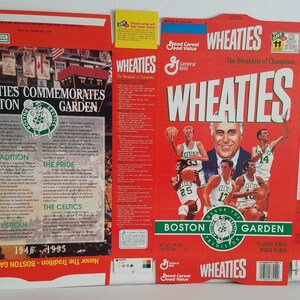 May include: A Wheaties cereal box featuring a red background with the text "WHEATIES" in white and green. The box commemorates the Boston Garden and features images of Boston Celtics players, including Larry Bird, Robert Parish, and Kevin McHale. The box also includes the text "The Breakfast of Champions."