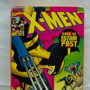 May include: X-Men Days of Future Past #1 comic book cover. Features Wolverine with claws extended, battling another character. Bold yellow and pink text reads "X-MEN" and "DAYS OF FUTURE PAST 1". Marvel Comics logo in the upper left corner.