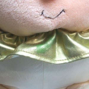 May include: A set of three ceramic mugs with a speckled, matte finish. The mugs are in shades of cream, light gray, and dark gray. Each mug has a simple, minimalist design and a rounded handle.