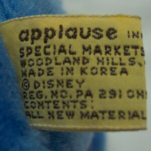 May include: Yellow tag with brown text that reads "applause IND SPECIAL MARKETS WOODLAND HILLS MADE IN KOREA &copy;DISNEY REG. NO. PA 2910N CONTENTS: ALL NEW MATERIAL"