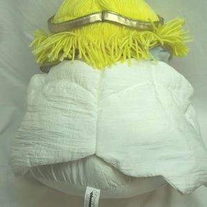 May include: A set of three ceramic mugs with a speckled, cream-colored glaze. Each mug features a different hand-painted floral design in shades of blue, green, and yellow. The mugs have a simple, rounded shape and a comfortable handle.