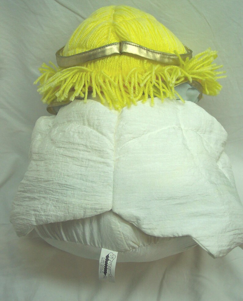 May include: A set of three ceramic mugs with a speckled, cream-colored glaze. Each mug features a different hand-painted floral design in shades of blue, green, and yellow. The mugs have a simple, rounded shape and a comfortable handle.