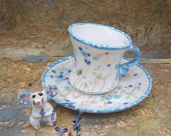 Taza de té retro y atrevida en tonos aguamarina y verde azulado