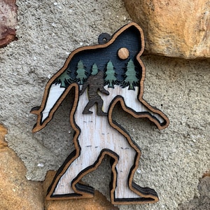 Bigfoot wood layered Christmas ornament Sasquatch nature scene