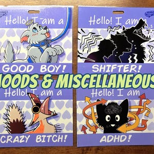 May include: Four illustrated cards with the phrases "Good Boy!", "Shifter!", "Crazy Bitch!", and "ADHD!" on a purple background. The cards feature cartoon images of a dog, wolf, fox, and cat. The text "MOODS & MISCELLANEOUS!" is also present.