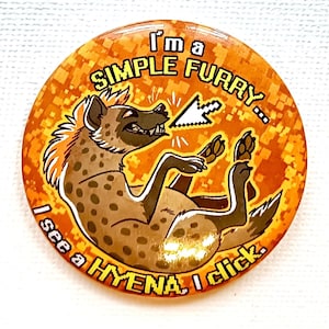 May include: Circular badge with an orange pixelated design, featuring a cartoon hyena. The hyena is brown with spots and a yellow mane. Text reads "I'm a SIMPLE FURRY... I see a HYENA I click."