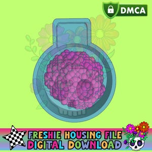 May include: A teal-colored, circular object with a handle, containing a pink, textured sphere. The background is lime green with floral accents. Text at the bottom reads "FRESHIE HOUSING FILE DIGITAL DOWNLOAD". A DMCA icon is in the top right.