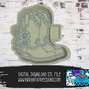 May include: A digital download STL file for a 3D printed cookie cutter in the shape of a pair of cowboy boots with floral embellishments. The boots are outlined in black and have a light gray fill. The floral embellishments are in shades of gray and white.