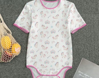 May include: White short-sleeved bodysuit with a pink trim. The bodysuit has a unicorn and rainbow print.