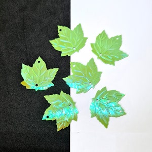 5g (approx 46)AB green maple leaf sequins