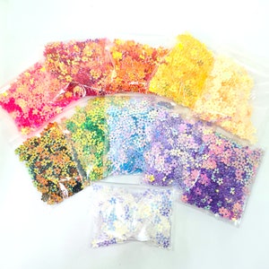 11 sachets de 5 g de petites paillettes de fleurs dorées de 5 mm