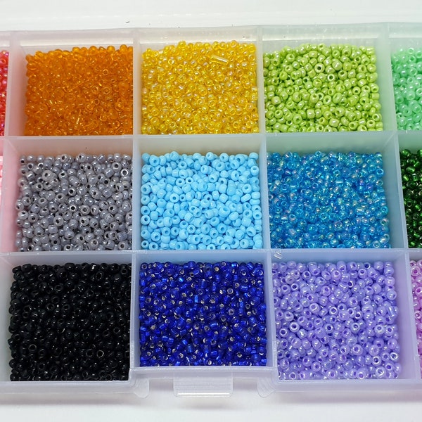 15 colours of 2mm seed beads in a plastic sectioned box