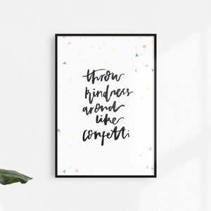 Könnte beinhalten: Ein weißer Poster mit schwarzem Text, der "Throw kindness around like confetti." lautet. Der Poster ist von einem schwarzen Rahmen umgeben und hat einen weißen Hintergrund mit bunten Konfetti.