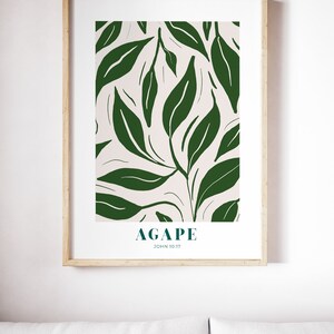 May include: A framed print with a white background and a green leafy pattern. The text "AGAPE JOHN 10:17" is at the bottom of the print.