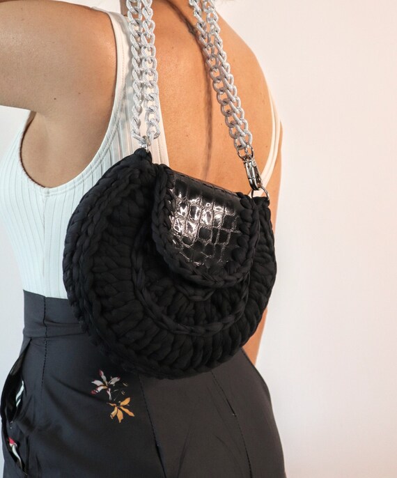 Black round cheap clutch bag