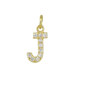 May include: A gold-coloured pendant in the shape of the letter "J", encrusted with small, clear gemstones. The pendant has a loop at the top for attaching to a chain. The gemstones are evenly spaced along the letter's form.