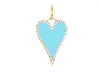 May include: A gold heart charm with a light blue enamel center and a border of small clear diamonds.