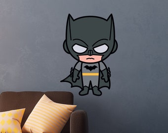 May include: A black and yellow cartoon illustration of Batman with a serious expression. The illustration is on a gray background.