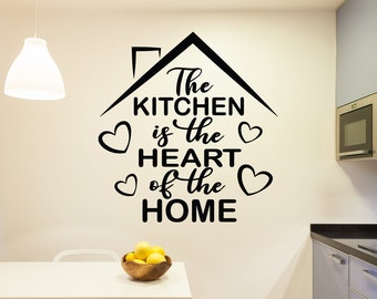 May include: Black and white vinyl wall decal with the text "The Kitchen is the Heart of the Home" in a house shape with hearts around the text.