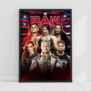 May include: Framed poster with the WWE Raw logo and several wrestlers. The poster has a black frame and a red and black background. The wrestlers are in various poses, with serious expressions.