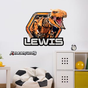 May include: A wall decal featuring an orange and black robotic dinosaur with an open mouth, set within a hexagonal frame. The name "LEWIS" is displayed below in white letters with a black outline. The word "ARMORSAURS" is also present.