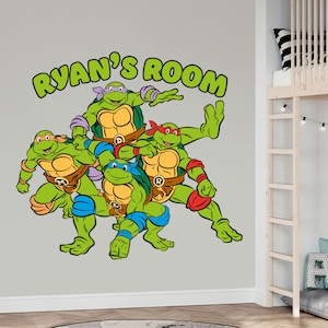 May include: A green, red, blue, and purple Teenage Mutant Ninja Turtles wall decal with the text "Ryan's Room".