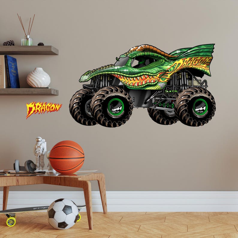 May include: A green and yellow monster truck with a dragon design. The truck has large black tires with green rims and the word "DRAGON" in orange and yellow lettering.