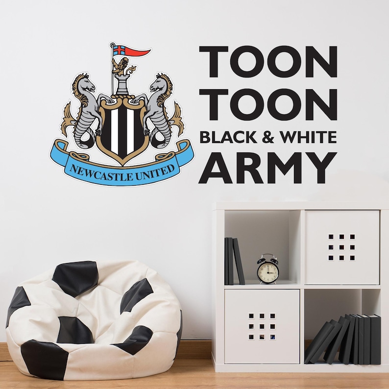 May include: Black and white wall decal featuring the Newcastle United Football Club crest and the text "Toon Toon Black & White Army".