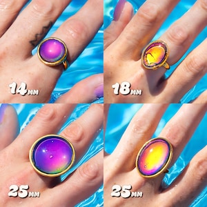 Mood ring size chart comparisons, four gold rings two circle sizes 14mm and 25mm with a purple stone and two oval 18mm and 25mm size with a yellow orange stone.