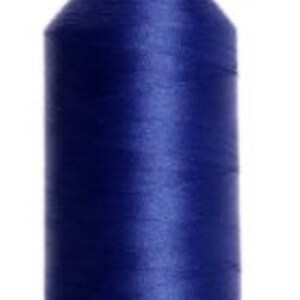 May include: A spool of navy blue thread for sewing or embroidery. The thread is tightly wound on a cylindrical spool with a green base and top. The thread has a slight sheen.