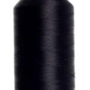 May include: A spool of black thread with a green base and top. The thread is tightly wound around the spool, creating a cylindrical shape. This thread is likely used for sewing, embroidery, or other textile crafts.