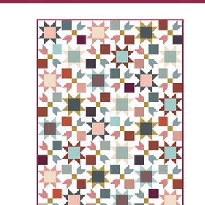 May include: A quilt pattern titled "Nora" by Suzanne Jackman. The design features a repeating pattern of star and square shapes in various colors, including pink, blue, brown, and gold, set against a white background. The "splendid speck" logo is at the bottom.